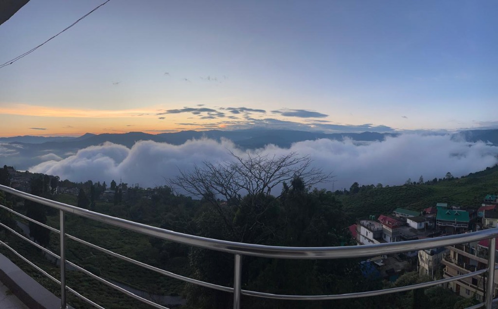 Spectacular sea of clouds and mountain valley view from Mount 10 Rooftop Cafe