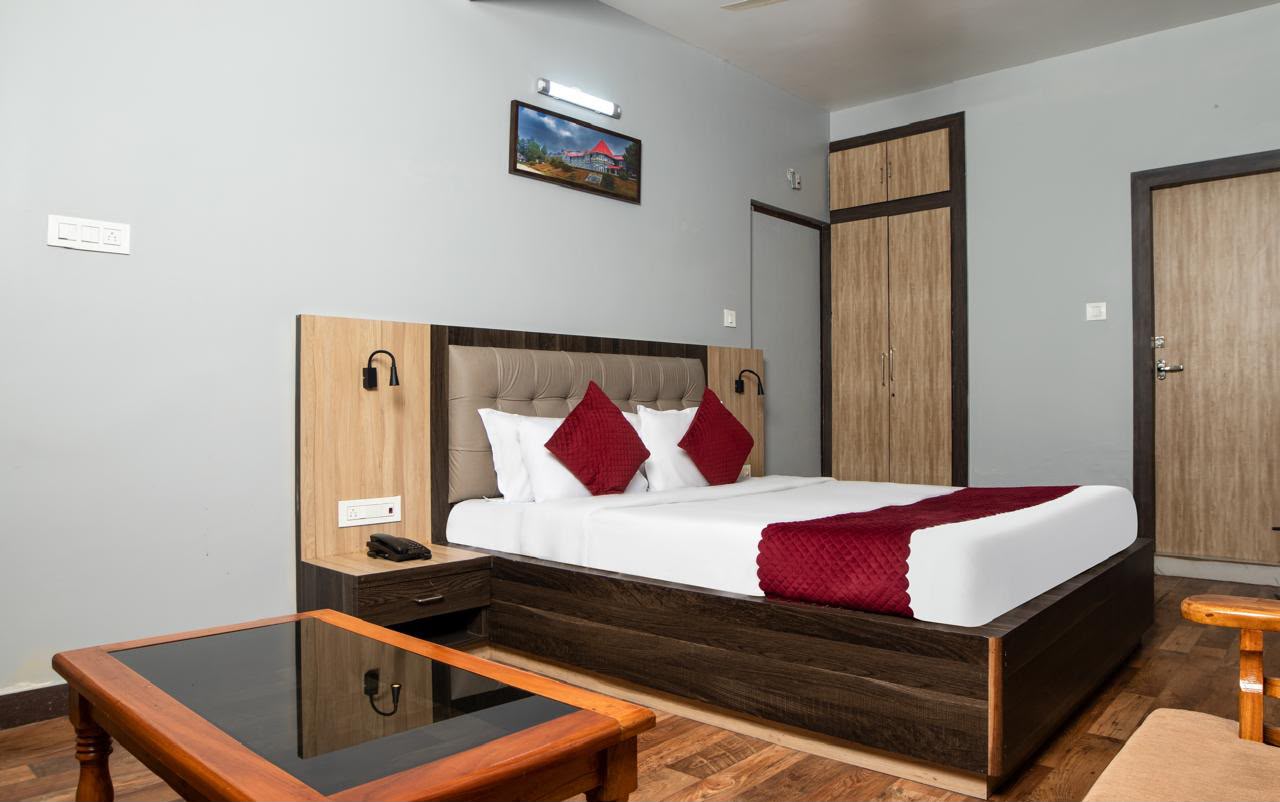 Family Room spacious double bed with wooden coffee table and wardrobe